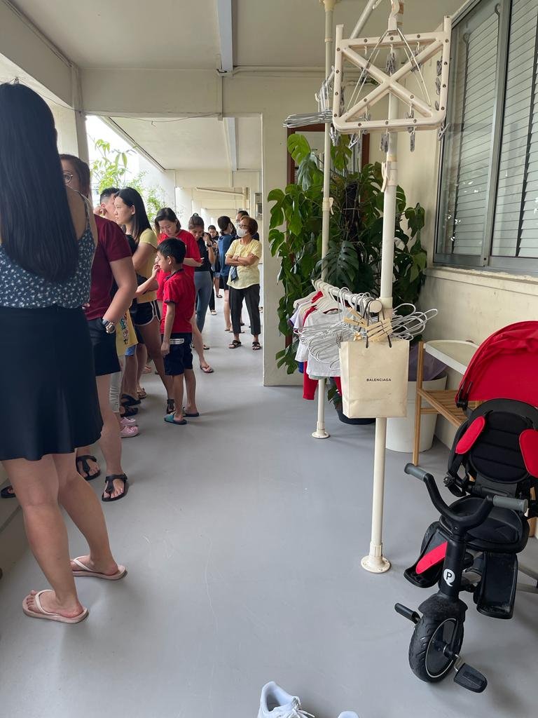 Prospective buyers queueing outside the property viewing